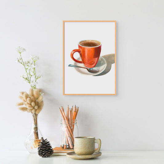 Framed print of a cappuccino in an orange coffee mug on a white saucer.