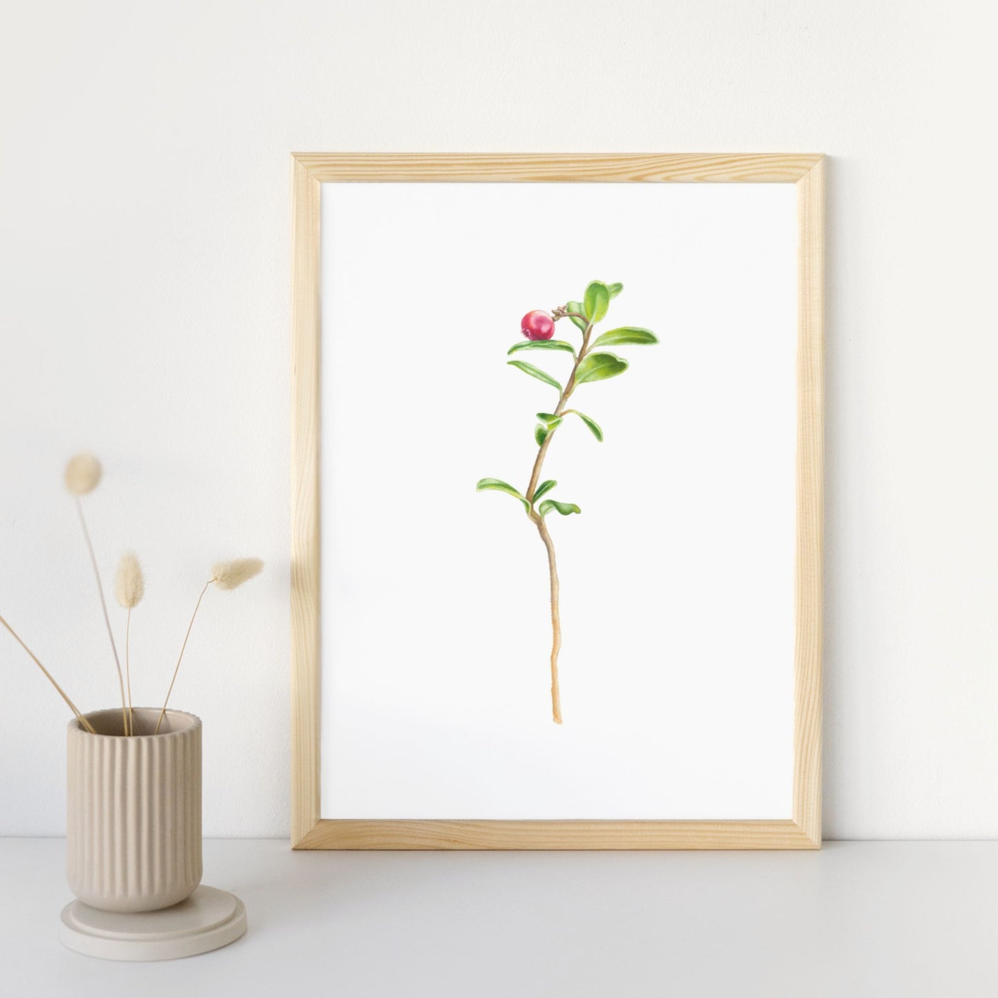 Framed painting of a single wild cranberry.