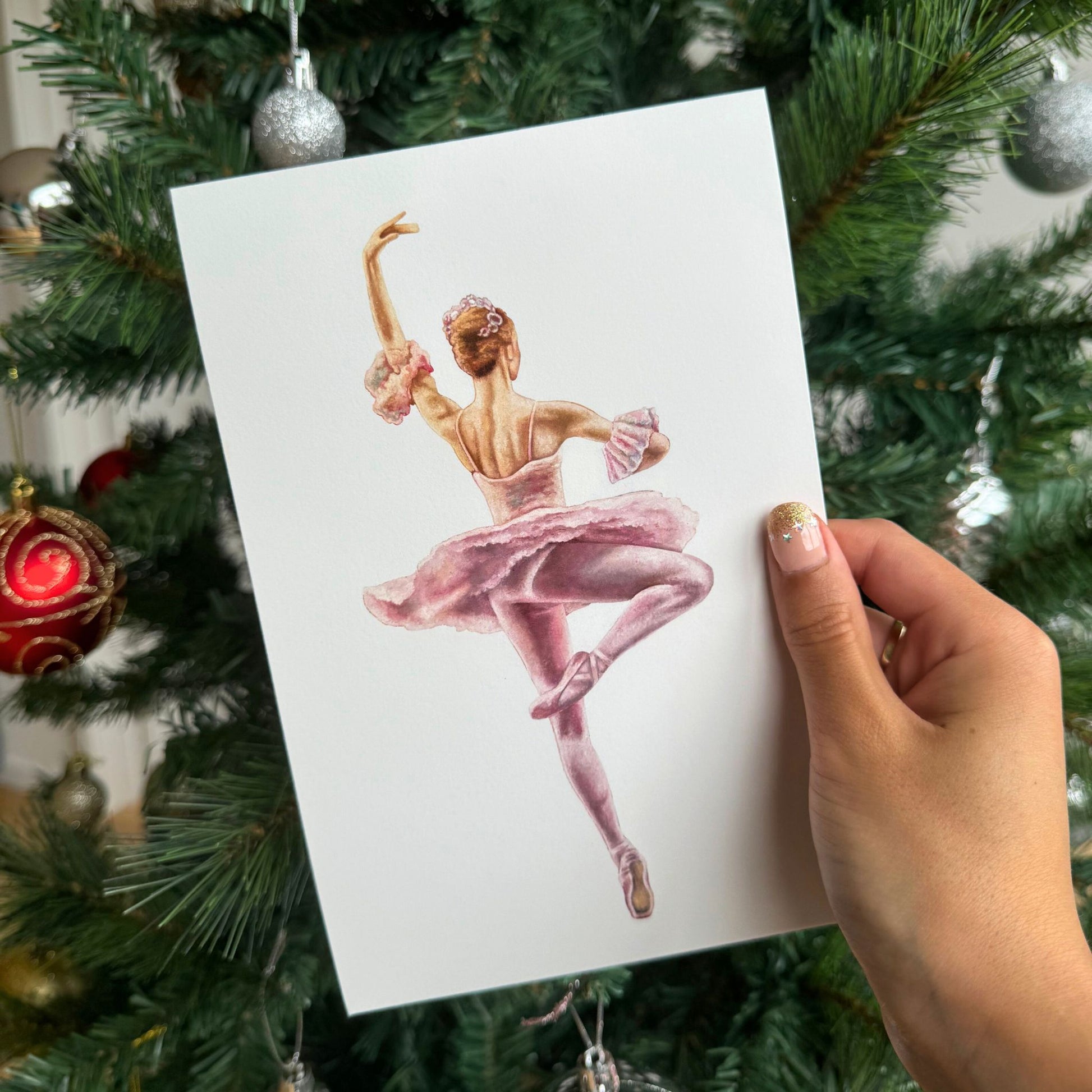 Print of a ballerina in a pink tutu performing a pirouette.